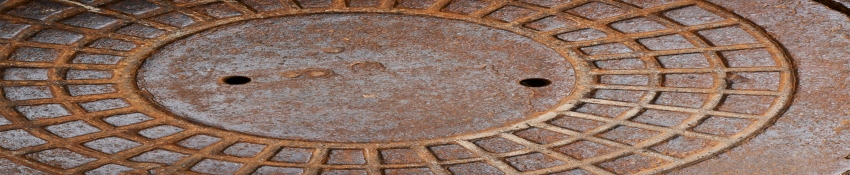 Hinged manhole covers